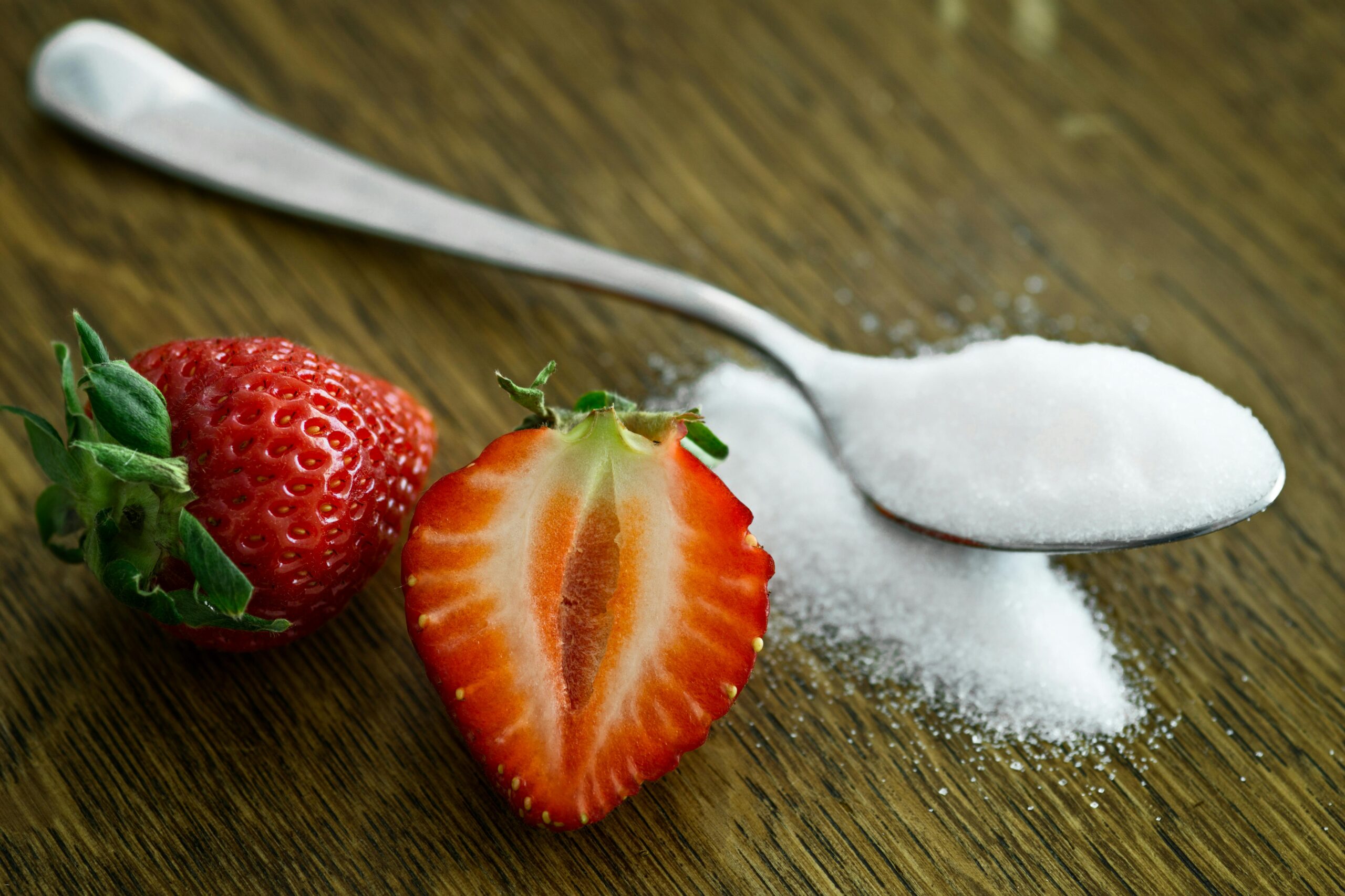 Putting sugar on strawberries